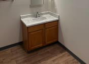 Thumbnail 12 of 12 - A bathroom with a mirror and a cabinet.