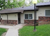 Thumbnail 2 of 11 - a house with a lamp post in front of it