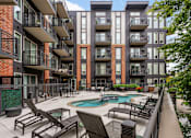 Thumbnail 27 of 30 - Outdoor pool deck at The Flats at West End Apartments, Minnesota