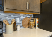Thumbnail 7 of 25 - a kitchen with a counter top and a refrigerator  at The Cosmopolitan, St Paul
