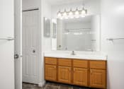 Thumbnail 16 of 45 - a bathroom with a sink and a mirror and a shower at Cityscape, St Louis Park, MN, 55416