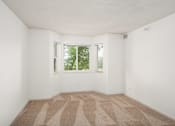 Thumbnail 11 of 45 - an empty room with carpet and a window at Cityscape, St Louis Park, 55416