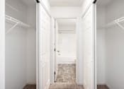 Thumbnail 14 of 45 - a closet in a bedroom with white doors at Cityscape, St Louis Park, MN, 55416