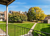 Thumbnail 14 of 30 - Balcony overlooking the grounds and walking paths at Eden Commons in Eden Prairie, MN 55