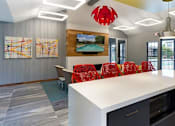 Thumbnail 19 of 30 - Community Room with seating, a full kitchen, and lounge chairs at Eden Commons in Eden Prairie, MN 55344