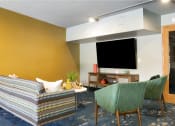 Thumbnail 9 of 26 - Lounge Area With TV  at Pebblebrook Court, Bloomington, Minnesota