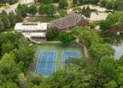 Thumbnail 22 of 26 - Aerial Building, Pool, and Tennis Courts  at Regency Woods, Minnetonka