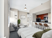 Thumbnail 1 of 25 - two beds in a room with a kitchen and a living room  at The Cosmopolitan, St Paul, Minnesota