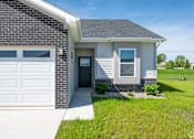 Thumbnail 31 of 37 - A house with a grey roof and a white garage door.at Concord Crossing, Indiana  
