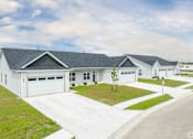 Thumbnail 1 of 37 - A white house with a grey roof and a driveway in front.at Concord Crossing, Lafayette Indiana  