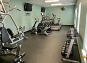 Thumbnail 8 of 14 - a gym with several machines and weights on the floor at Shenandoah Properties in Lafayette, IN 47905