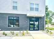 Thumbnail 1 of 14 - a building with a leasing office at Murdock Gardens Apartments, Lafayette, IN 47904