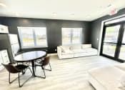 Thumbnail 8 of 14 - a living room with a couch a table and chairs at Murdock Gardens Apartments, Lafayette, IN 47904