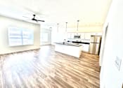 Thumbnail 8 of 37 - A kitchen with a wooden floor and white walls.at Concord Crossing, Lafayette Indiana  