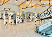 Thumbnail 37 of 37 - A gym with a variety of equipment including a Matrix machine.at Concord Crossing, Indiana, 47909 