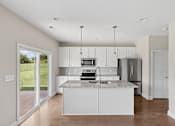 Thumbnail 26 of 44 - A kitchen with white cabinets and a marble countertop.