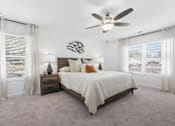 Thumbnail 21 of 25 - Primary bedroom with plush carpet and ample sunlight
