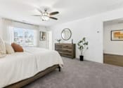 Thumbnail 22 of 25 - Serene master bedroom with natural light and ceiling fan