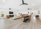 Thumbnail 15 of 25 - Bright open-concept clubhouse with modern ceiling fans
