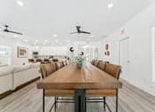 Thumbnail 18 of 25 - Open dining area with farmhouse table