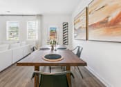 Thumbnail 5 of 25 - Spacious dining area with contemporary wood table