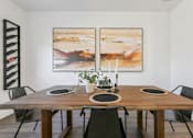 Thumbnail 4 of 25 - Stylish dining room with designer lighting fixtures