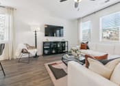 Thumbnail 8 of 25 - Open-concept living area with cozy fireplace feature