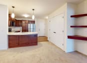 Thumbnail 26 of 28 - a kitchen and living room with wood cabinets and a counter