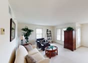 Thumbnail 19 of 28 - a living room with white walls and white carpet