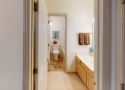 Thumbnail 16 of 28 - a bathroom with a toilet and a sink