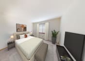 Thumbnail 19 of 21 - a bedroom with a large bed and a tv