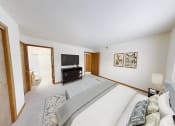 Thumbnail 15 of 19 - a bedroom with a bed and a tv