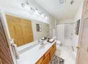 Thumbnail 16 of 19 - a bathroom with a sink and a toilet and a shower