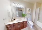 Thumbnail 10 of 64 - a bathroom with a large mirror and a toilet