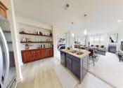 Thumbnail 9 of 64 - a kitchen and living room with a counter top in a house