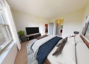 Thumbnail 8 of 64 - a bedroom with a bed and a tv