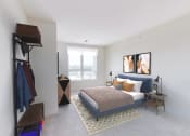 Thumbnail 33 of 64 - a bedroom with a bed and a window