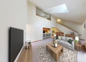 Thumbnail 1 of 26 - A living room with a grey couch and a wooden coffee table.