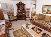 Thumbnail 12 of 12 - a living room with a couch and a table
