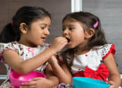 Thumbnail 22 of 28 - a couple of little girls sitting next to each other