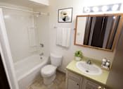 Thumbnail 23 of 32 - a bathroom with a sink toilet and a bath tub
