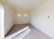 Thumbnail 18 of 32 - a living room with carpet and white walls