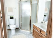 Thumbnail 8 of 28 - a small bathroom with a shower toilet and sink