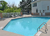 Thumbnail 28 of 28 - a swimming pool with a house in the background
