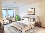 Thumbnail 9 of 28 - a bedroom with a bed and a window