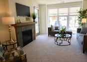 Thumbnail 9 of 53 - a living room with a fireplace and a television