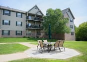 Thumbnail 1 of 22 - our apartments have a patio with a table and chairs