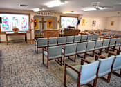 Thumbnail 46 of 49 - A church interior with rows of chairs and a sign that says "Thank You Jesus for Life".