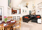Thumbnail 12 of 26 - a man sitting on a couch in a living room