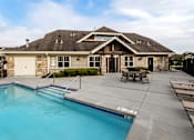 Thumbnail 17 of 21 - A house with a pool in the backyard.